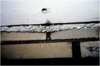 Asbest Asbestschnur zwischen Klinkerwand und Decke